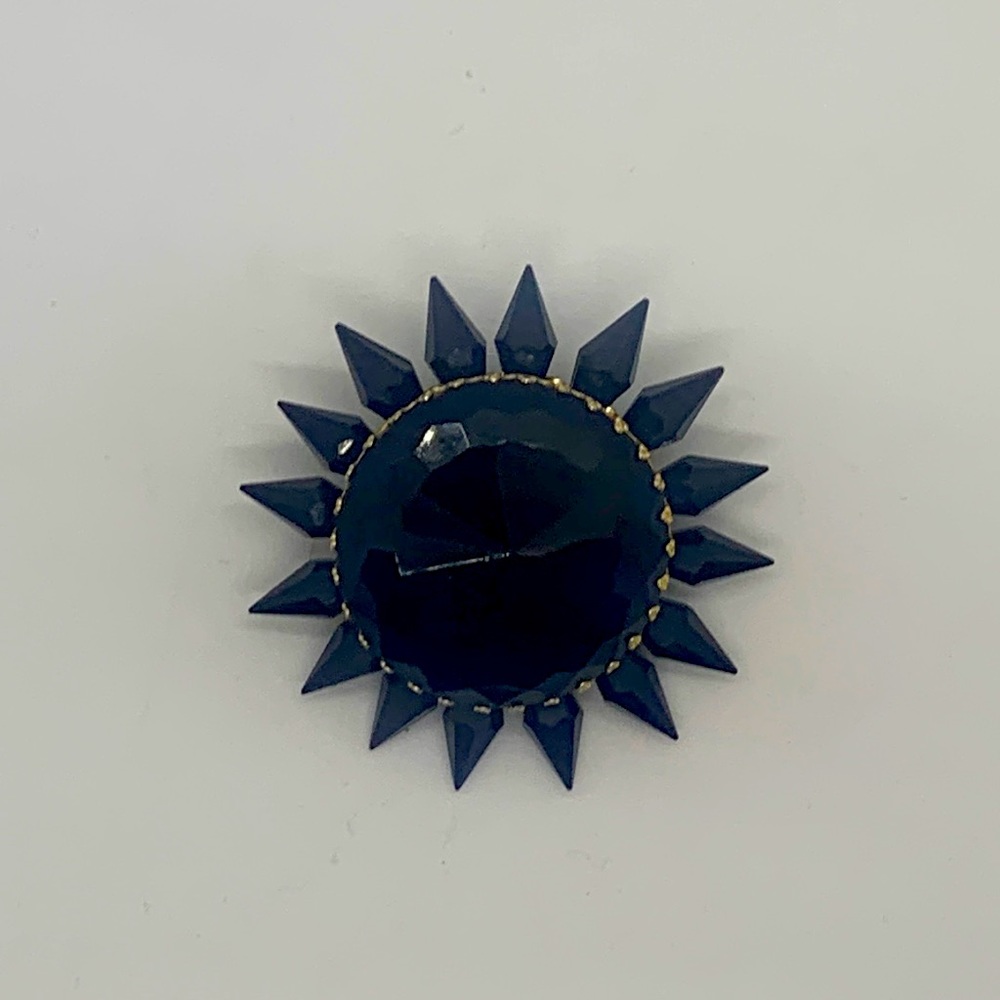 Vintage black jeweled brooch.